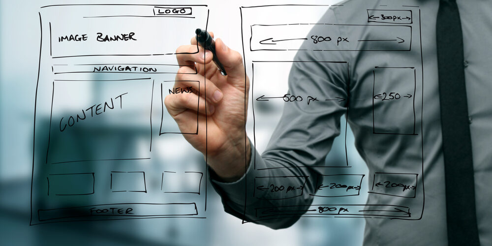 designer drawing website development wireframe
